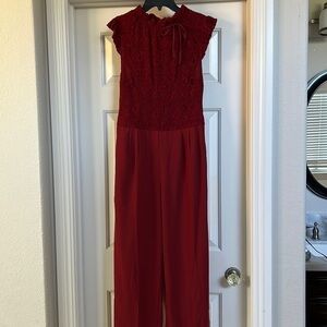 Women’s maroon jumpsuit. Lace top and silky bottom. Never worn. Size M